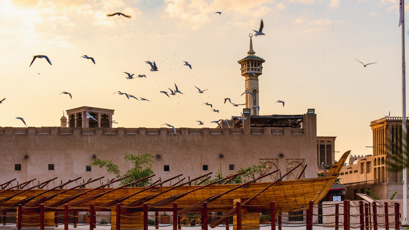 Historic Al Fahidi district with traditional dhow boats and wind towers, Dubai